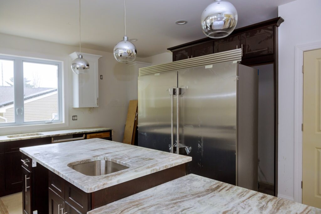 New white kitchen installed furniture cabinets and countertop with appliances